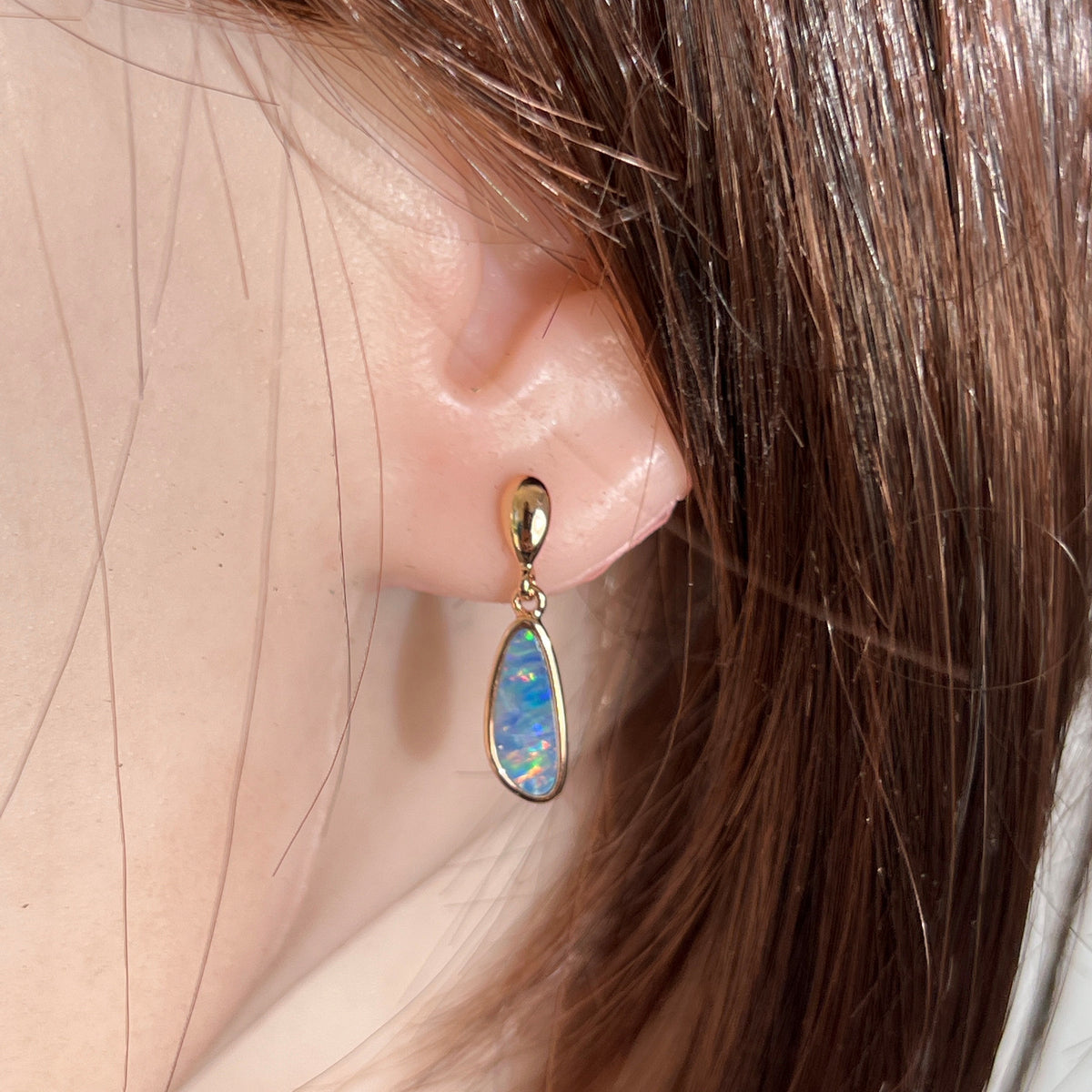 Worn Australian opal doublet earrings in rose gold-plated silver, violet, red, green and blue, 13 x 5mm