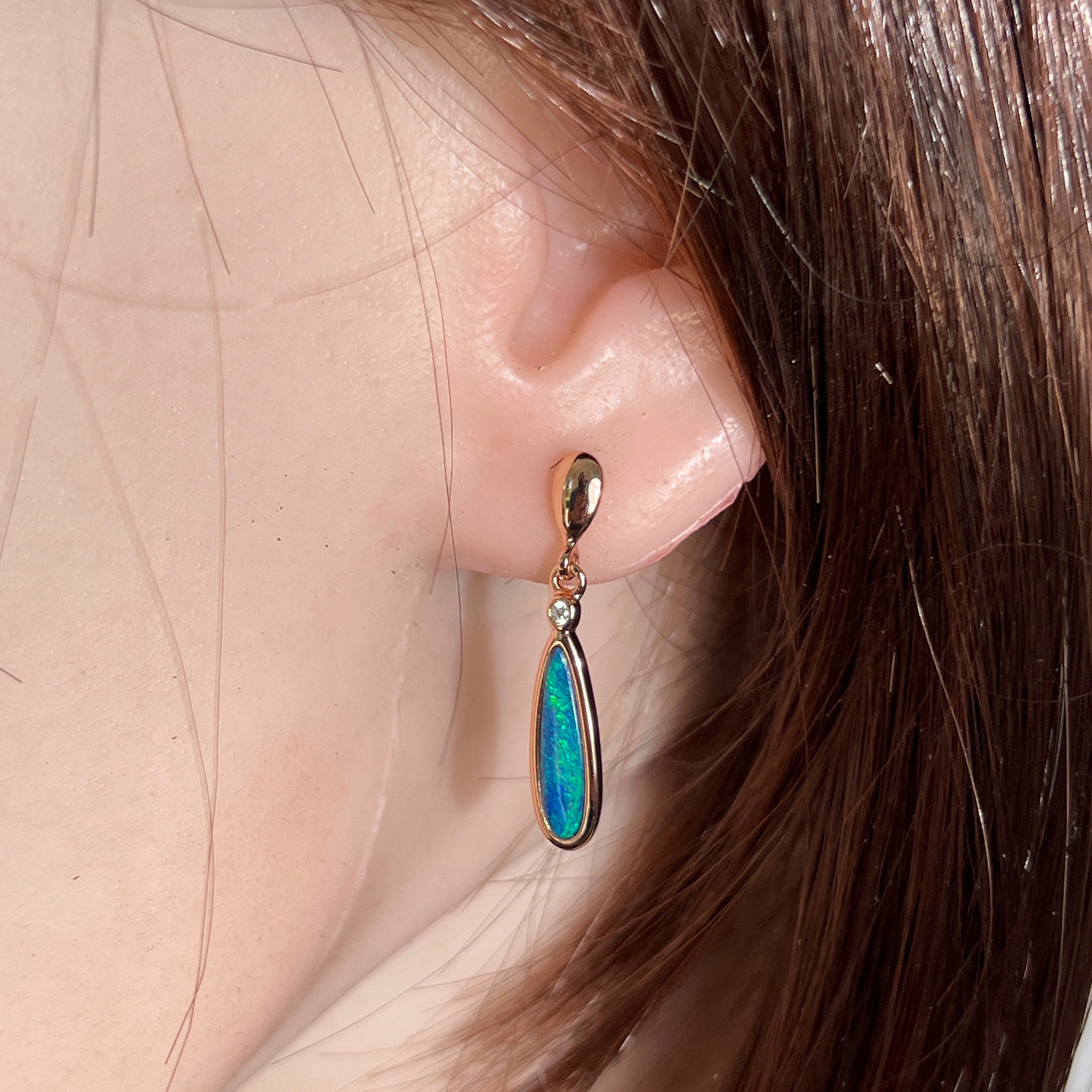 Worn Australian opal doublet earrings in rose gold-plated silver, green and blue, 15 x 5mm