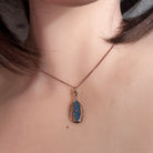 Worn Australian opal doublet pendant in rose gold-plated silver, blue, yellow, green and red, 16.5 x 5.5mm
