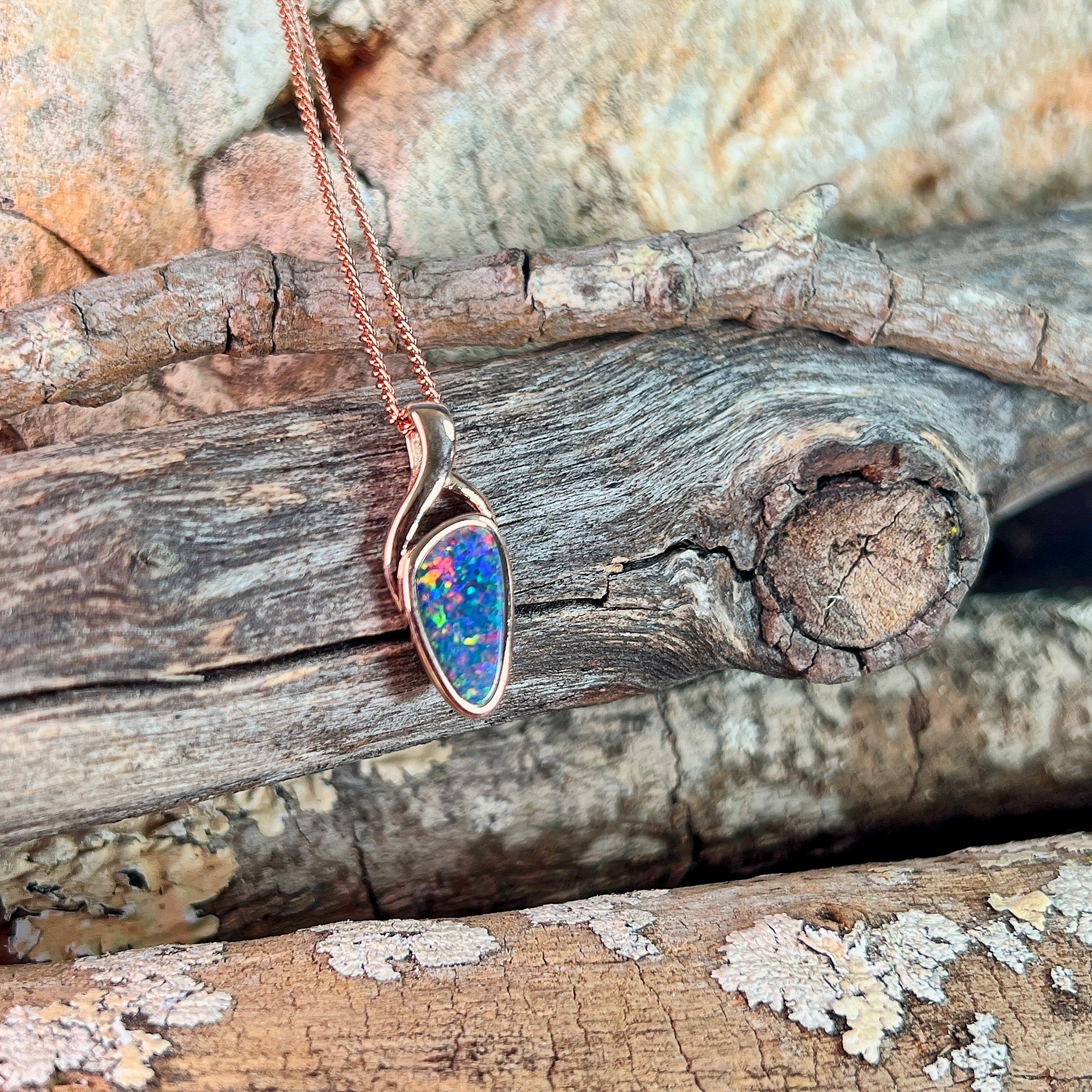rose gold-plated silver Australian opal doublet pendant with a 11 x 5.5mm triangular stone