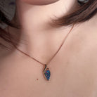 triangular Australian opal doublet pendant in rose gold-plated silver, worn at the neck