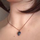12 x 8mm Australian opal triplet pendant worn at the neck, rose gold-plated silver, red, green and blue