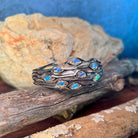 Close view of the Australian opal in the sterling silver wave cut-out bangle