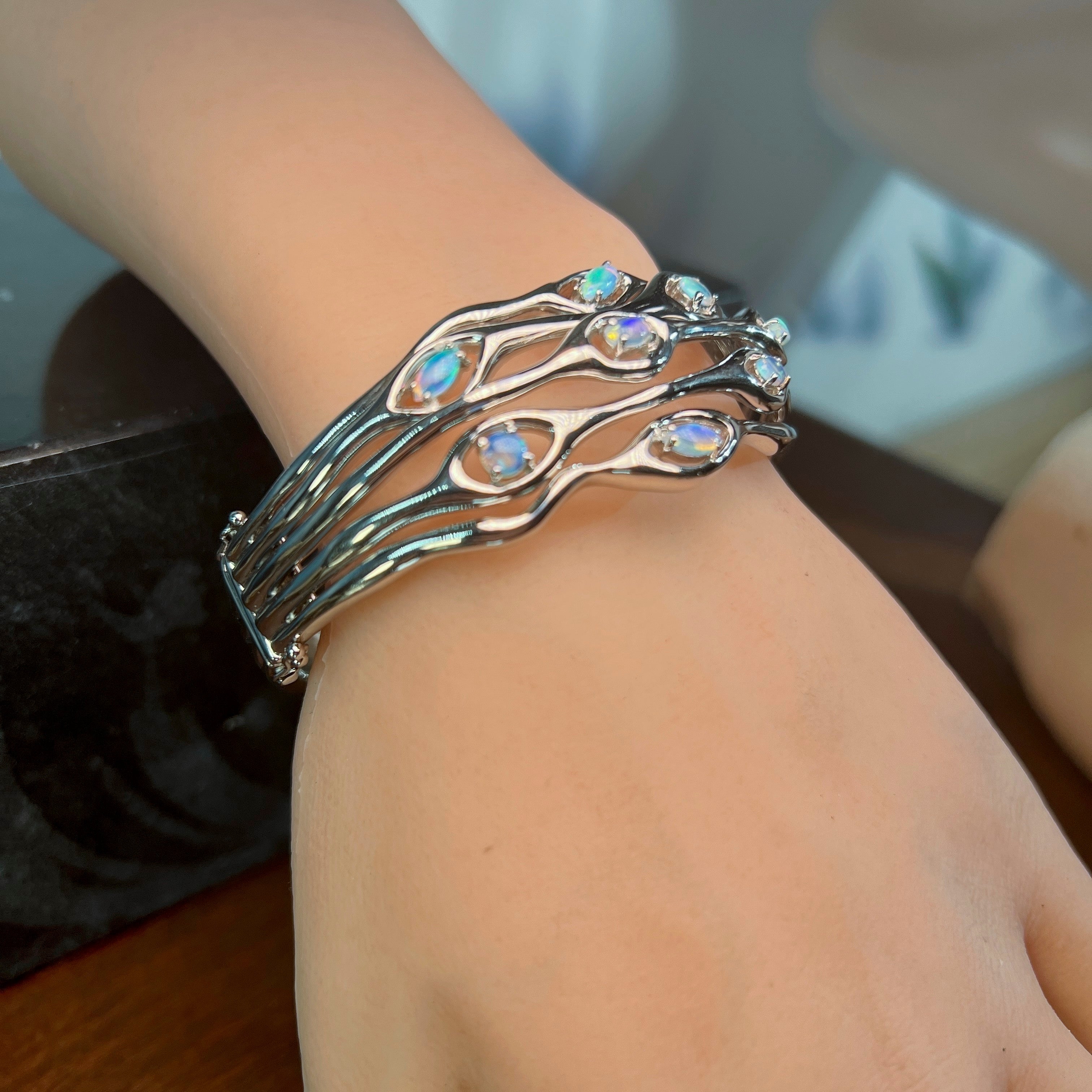 Opal wave bangle on the wrist, sterling silver with 0.92ct Australian opal