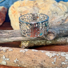 Sterling silver 26mm opal inlay bangle showing green and blue play-of-colour