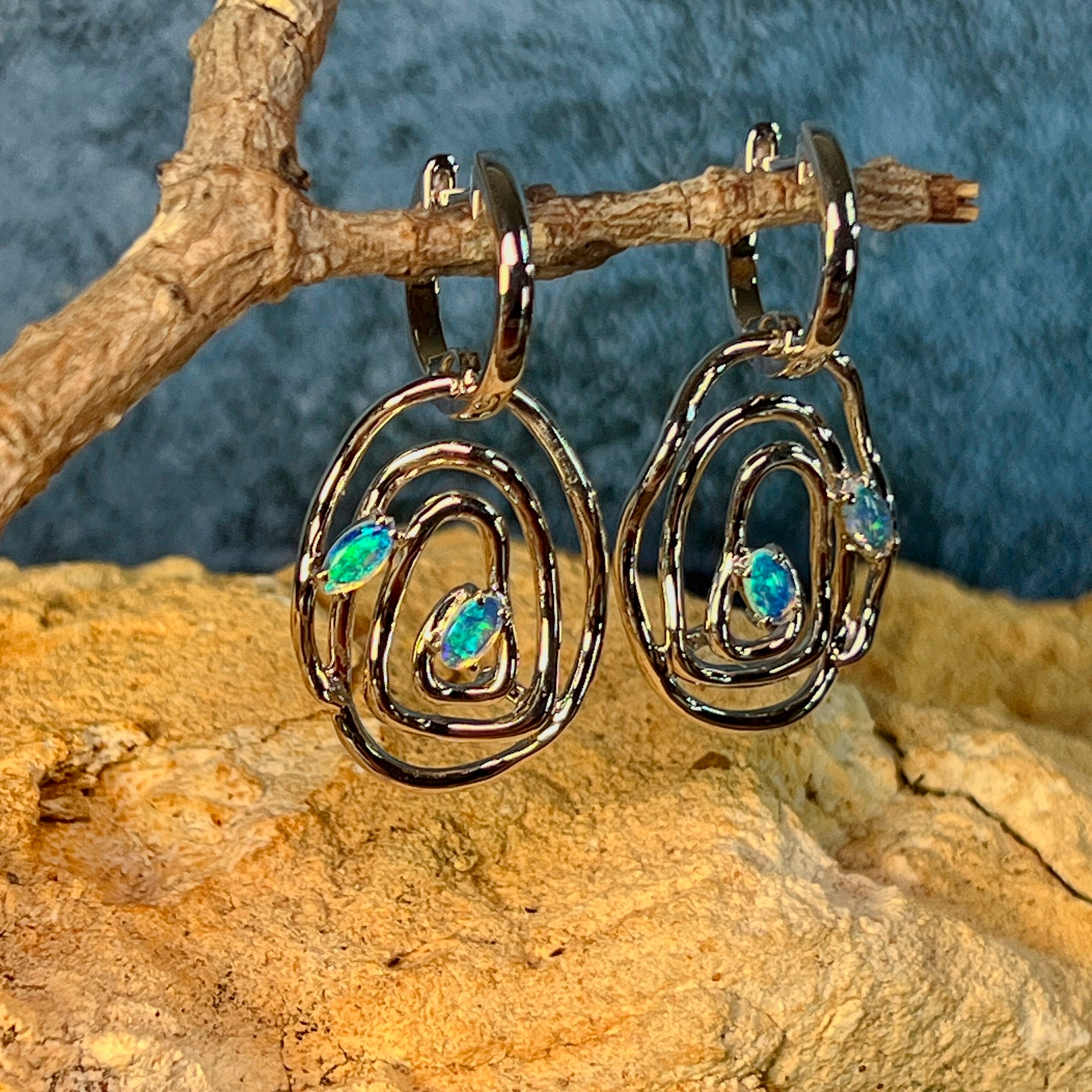 Concentric circle sterling silver earrings with Australian opal detail