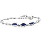 Sterling silver bracelet set with three freeform opal doublets on an adjustable chain, in blue and black