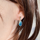 freeform Australian opal doublet earrings in sterling silver, worn on the ear