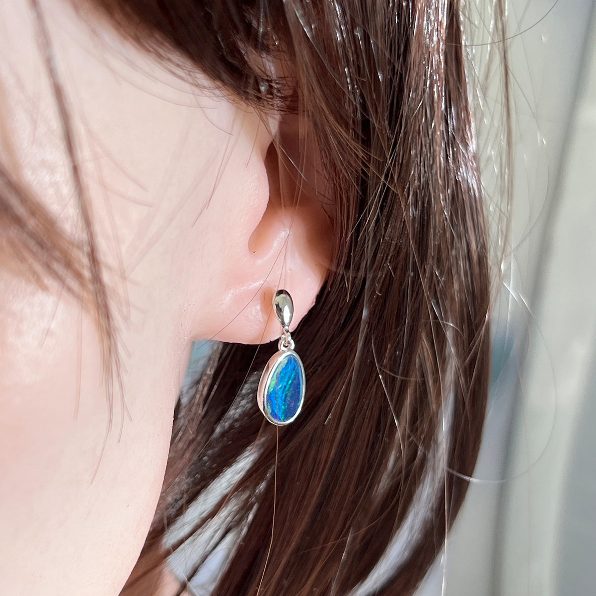 Worn Australian opal doublet earrings in sterling silver, red, pink, blue and green, 12 x 8mm