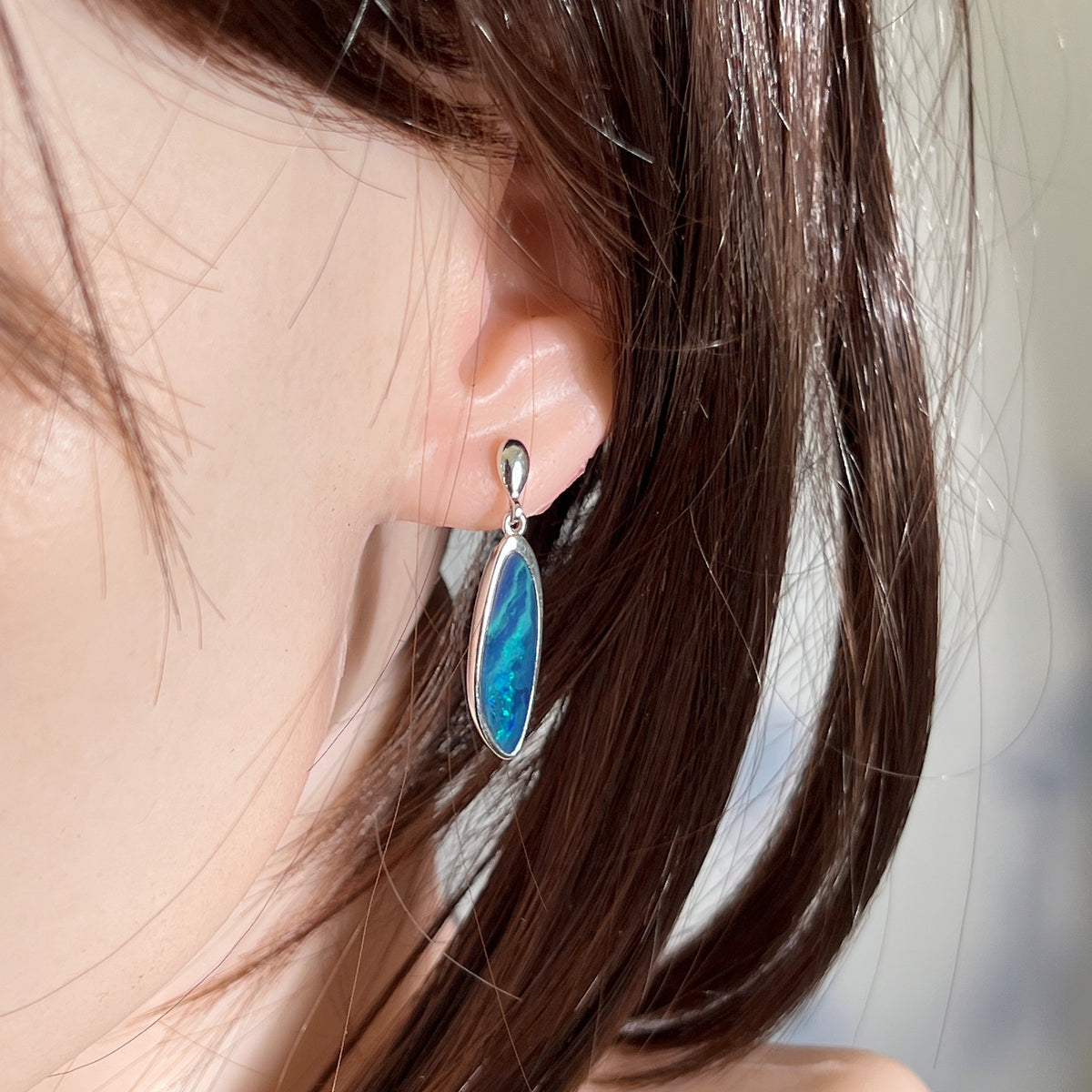 24 x 8mm freeform Australian opal doublet earrings worn on the ear, sterling silver