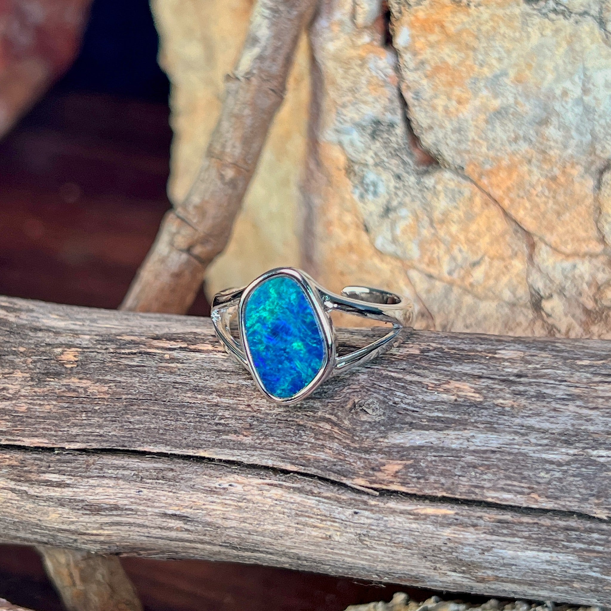 Close view of the blue and green play of colour in the freeform opal doublet