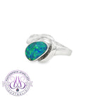 Sterling silver bypass solitaire ring with an oval opal doublet in green, blue and yellow