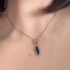 Australian opal doublet pendant worn at the neck, sterling silver, 16 x 5mm oval stone