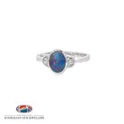 Oval opal doublet ring in sterling silver, bezel set with a cubic zirconia to each side, showing blue, red and green play of colour