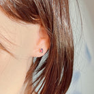 Silver opal triplet stud earring worn on the ear, side profile view