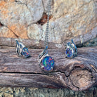 Silver opal triplet pendant and matching earrings with swirl detail on driftwood