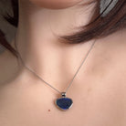 Australian opal triplet pendant worn at the neck, sterling silver, 12 x 15mm freeform stone