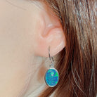 14 x 11mm oval Australian opal triplet earrings worn on the ear, sterling silver