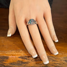 12 x 10mm oval Australian opal triplet ring on the hand, sterling silver