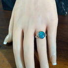 Australian opal triplet ring in sterling silver worn, oval stone, size US 6