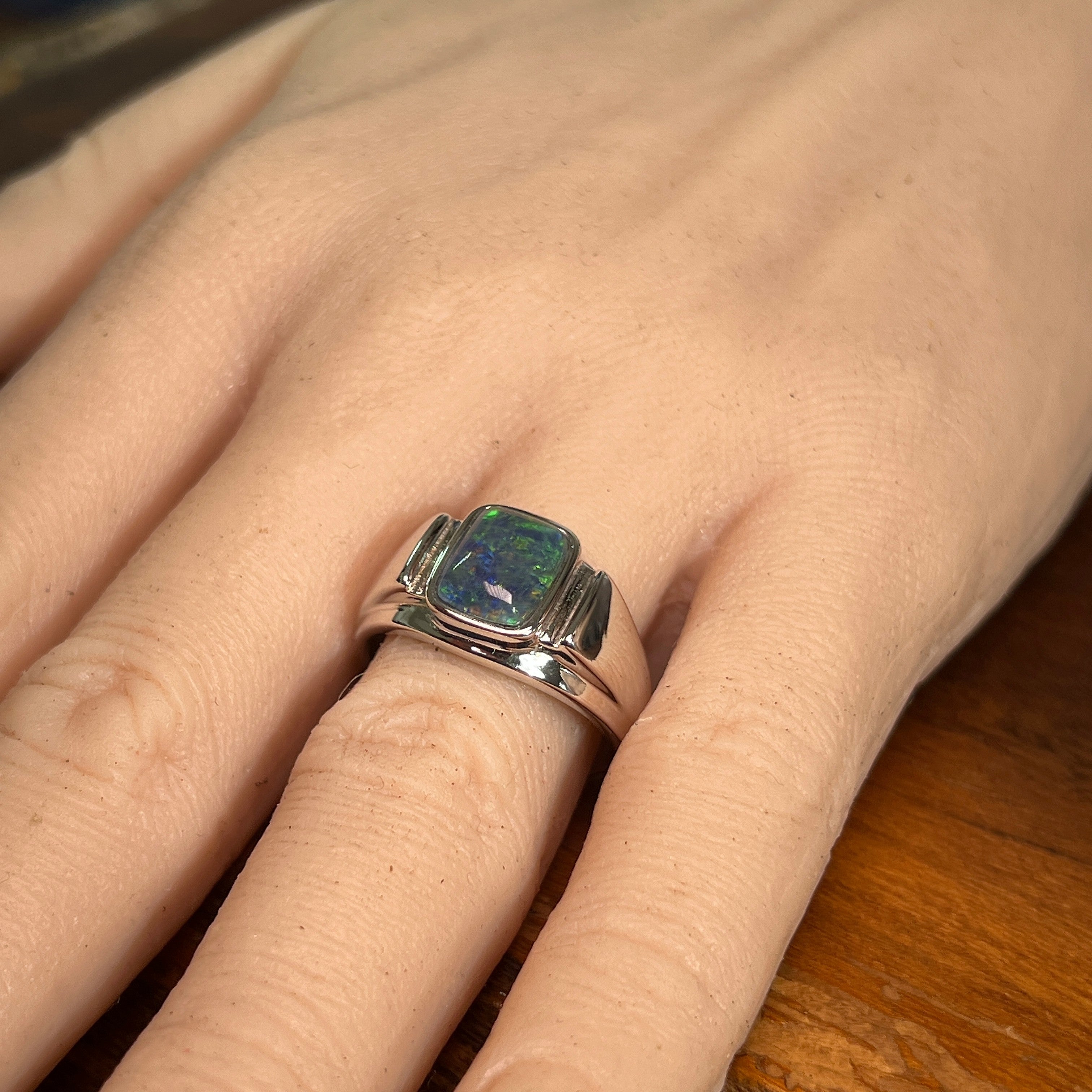 Australian opal triplet ring on the hand, sterling silver, 10 x 8mm rectangular stone