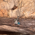 blue, green and yellow play-of-colour in a 5mm round Australian opal triplet pendant
