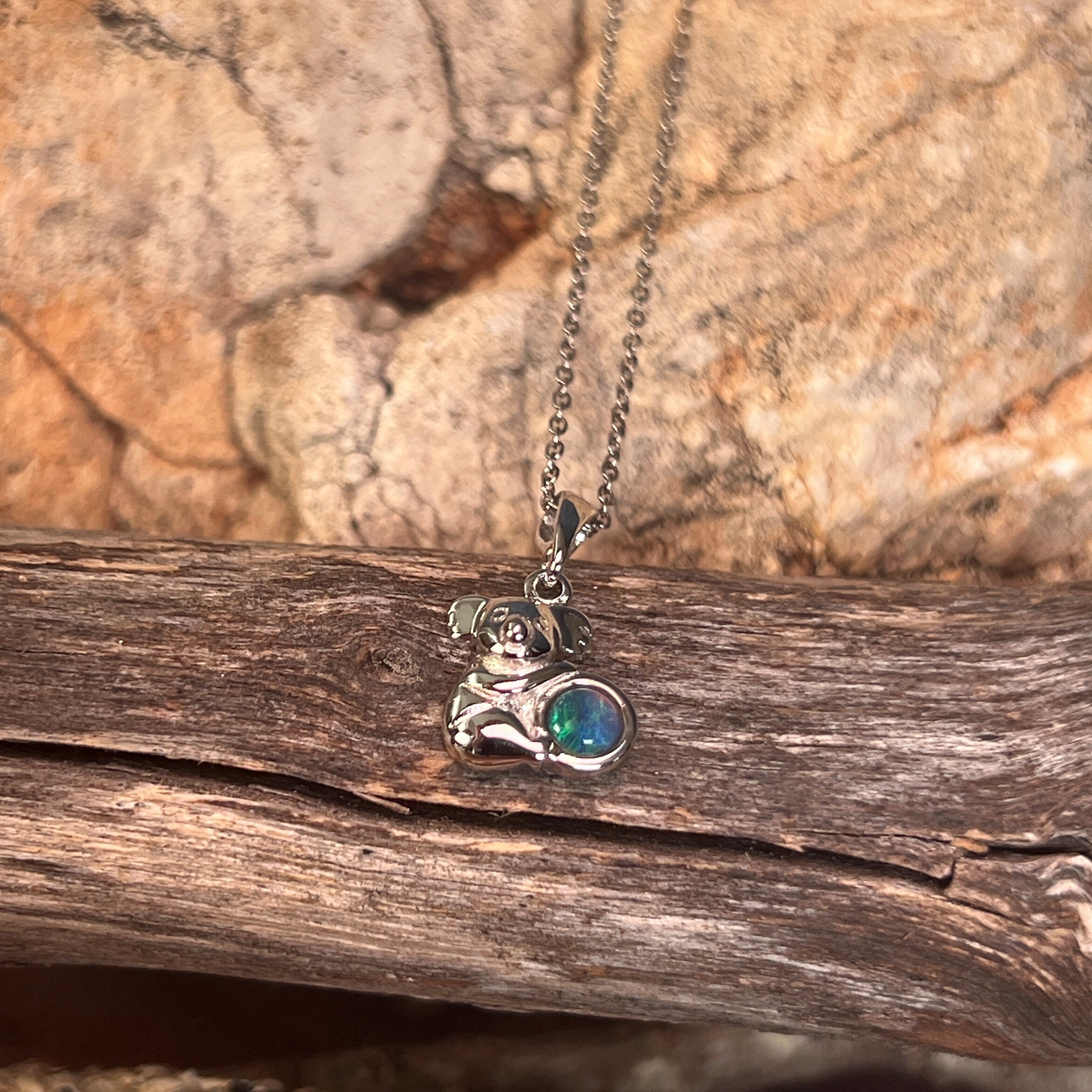 blue, green and yellow play-of-colour in a 5mm round Australian opal triplet pendant