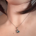round Australian opal triplet pendant in sterling silver, worn at the neck