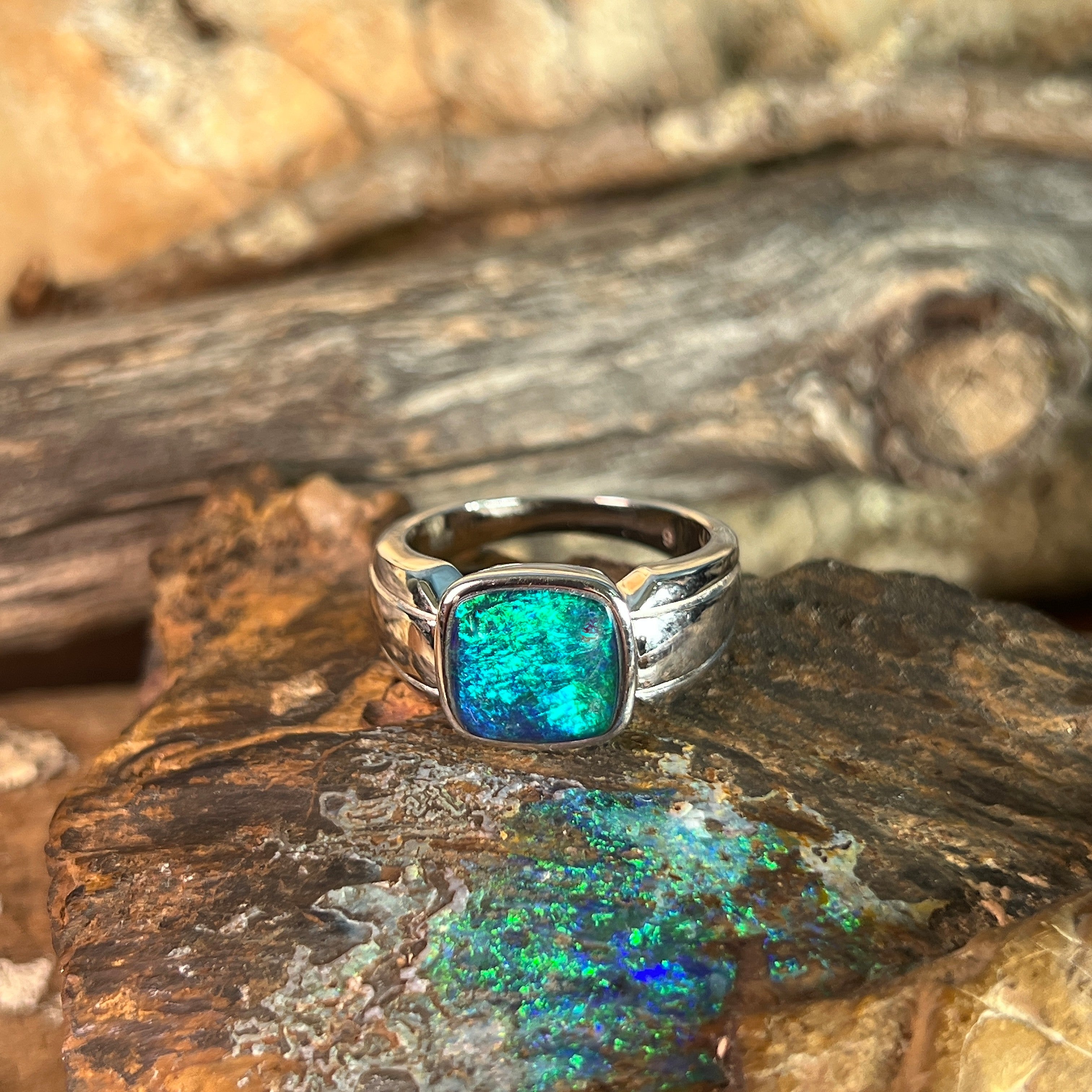 blue and green play-of-colour in a 10 x 10mm cushion-shaped Australian opal triplet ring