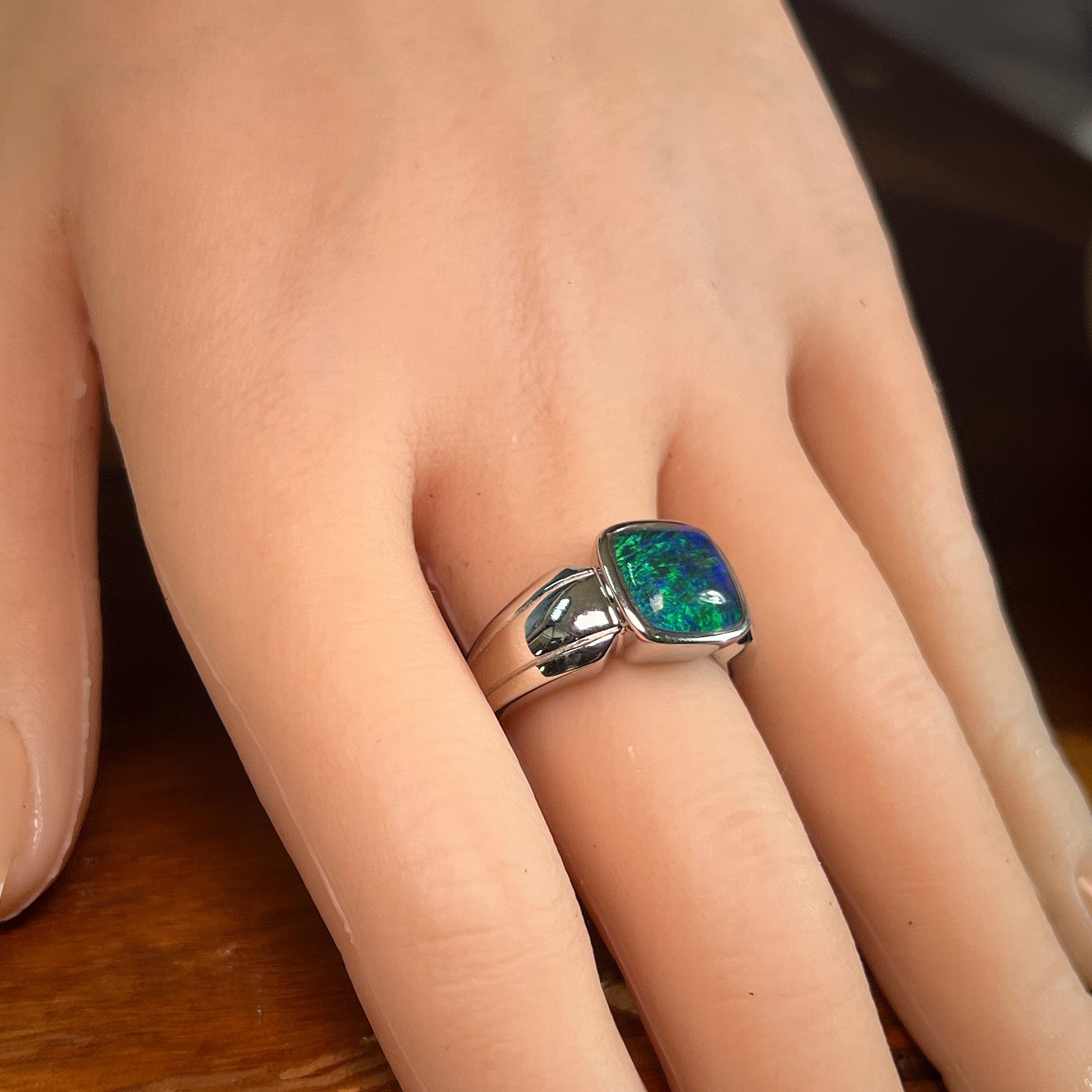 Australian opal triplet ring in sterling silver worn, cushion-shaped stone, size US 9
