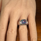 10mm cushion-shaped Australian opal triplet ring on the hand, sterling silver