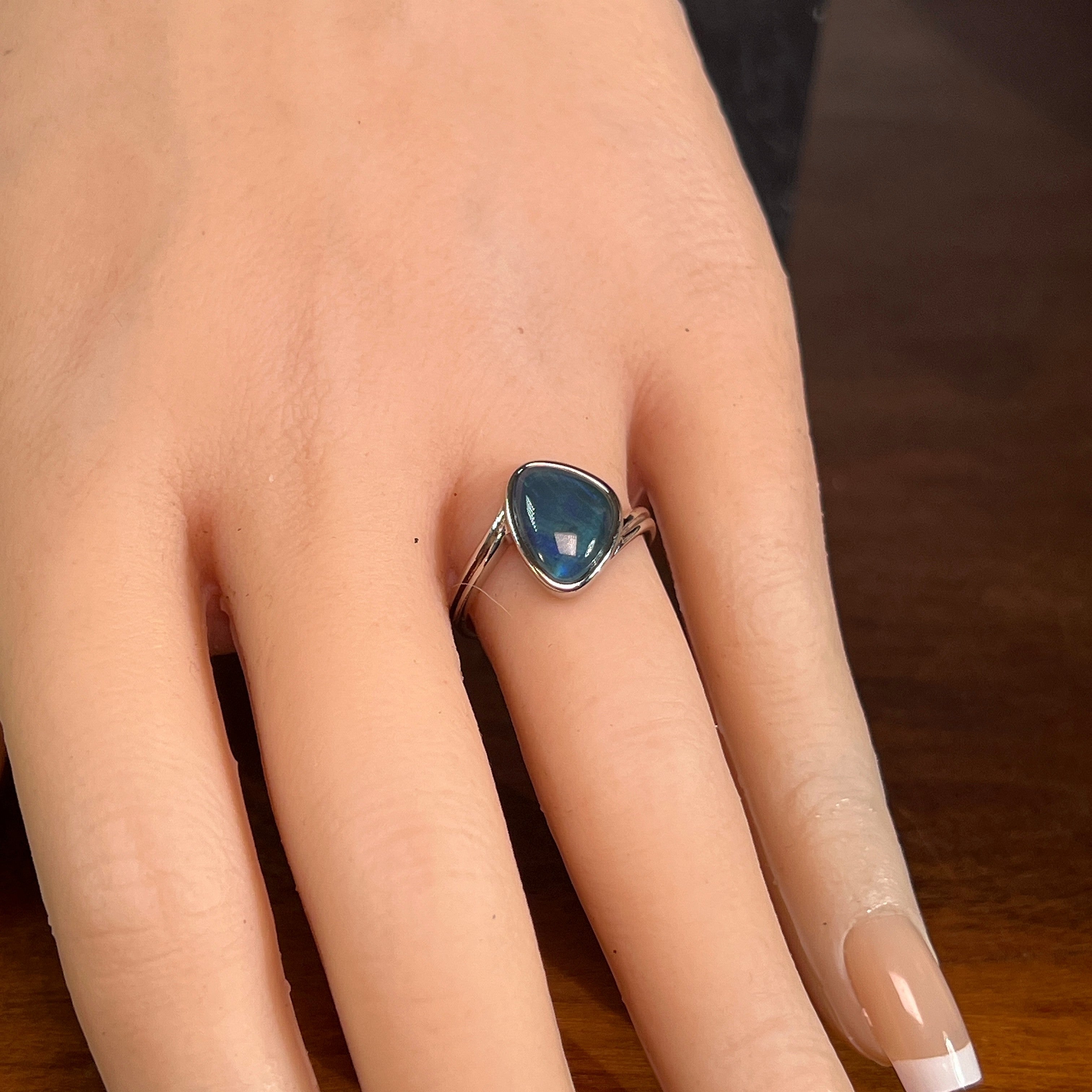 Australian opal triplet ring in sterling silver worn, triangular stone, size US 7