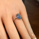 triangular Australian opal triplet ring worn, sterling silver, yellow, orange, blue and green
