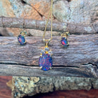 Gold-plated silver opal triplet pendant and matching studs on weathered driftwood