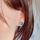 Gold-plated silver opal triplet cluster stud worn on the ear, side profile view