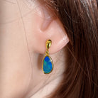 12 x 7mm freeform Australian opal doublet earrings worn on the ear, yellow gold-plated silver