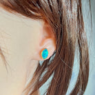 11.5 x 7.5mm marquise Australian opal doublet earrings worn on the ear, yellow gold-plated silver