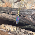 red, blue and green play-of-colour in a 16 x 8mm oval Australian opal doublet pendant