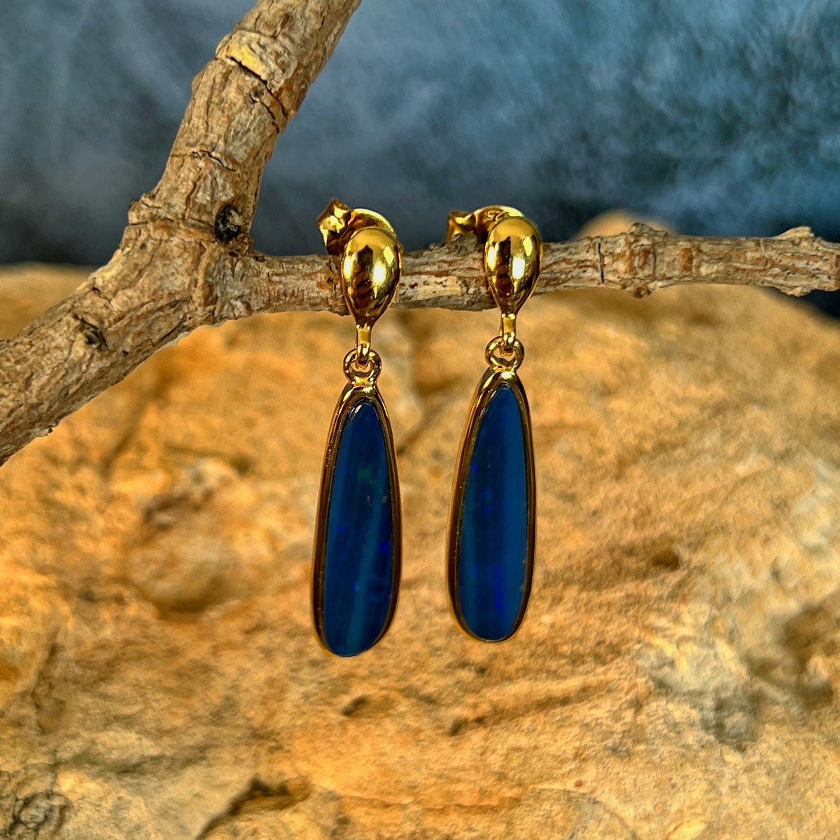 Australian opal doublet earrings, yellow gold-plated silver, 22 x 5.5mm stones showing green and blue