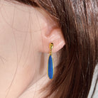 Australian opal doublet earrings worn on the ear, yellow gold-plated silver, 22 x 5.5mm pear-shaped stones