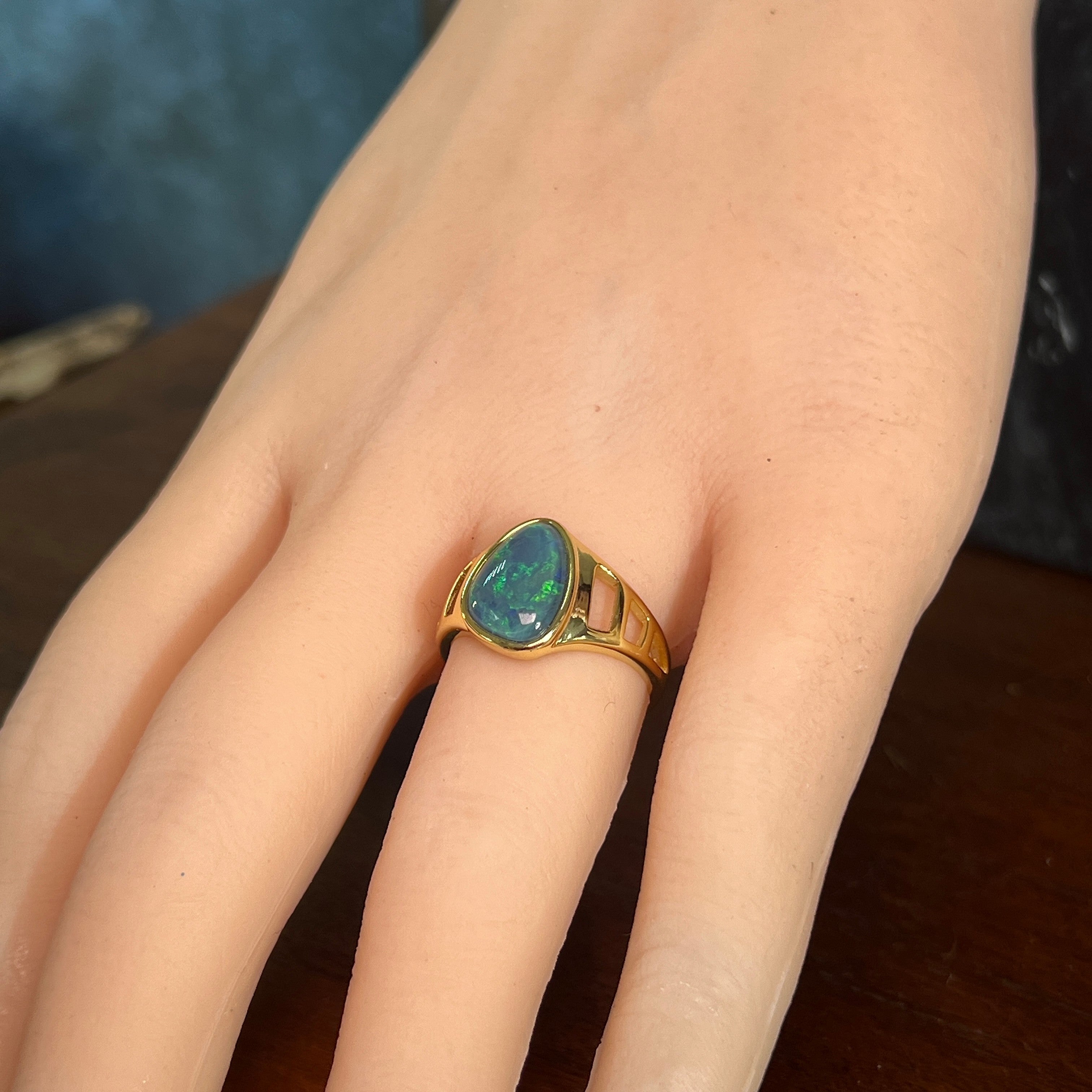 Australian opal triplet ring in yellow gold-plated silver worn, freeform stone, size US 7