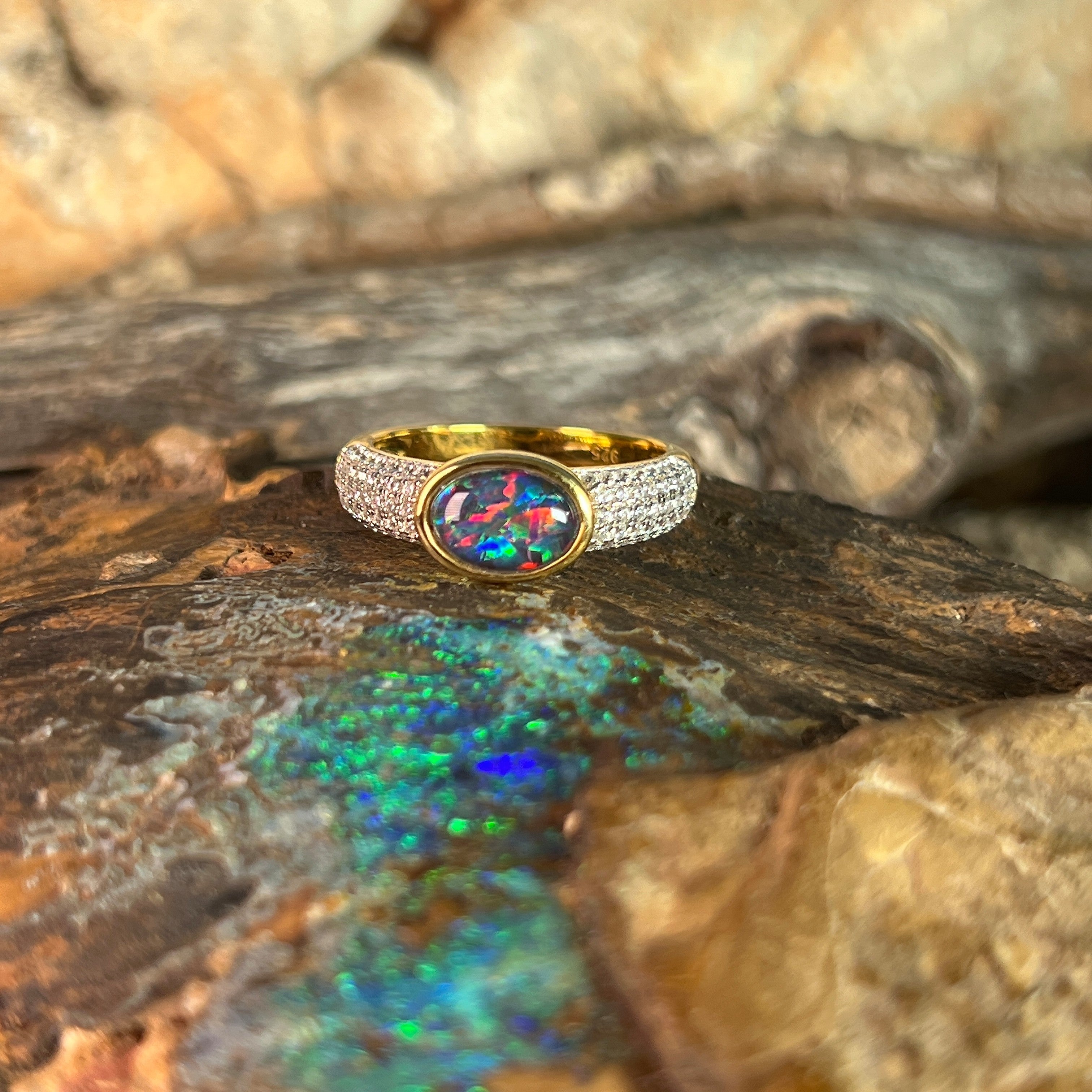 oval Australian opal triplet ring in yellow gold-plated silver, red, blue and green play-of-colour