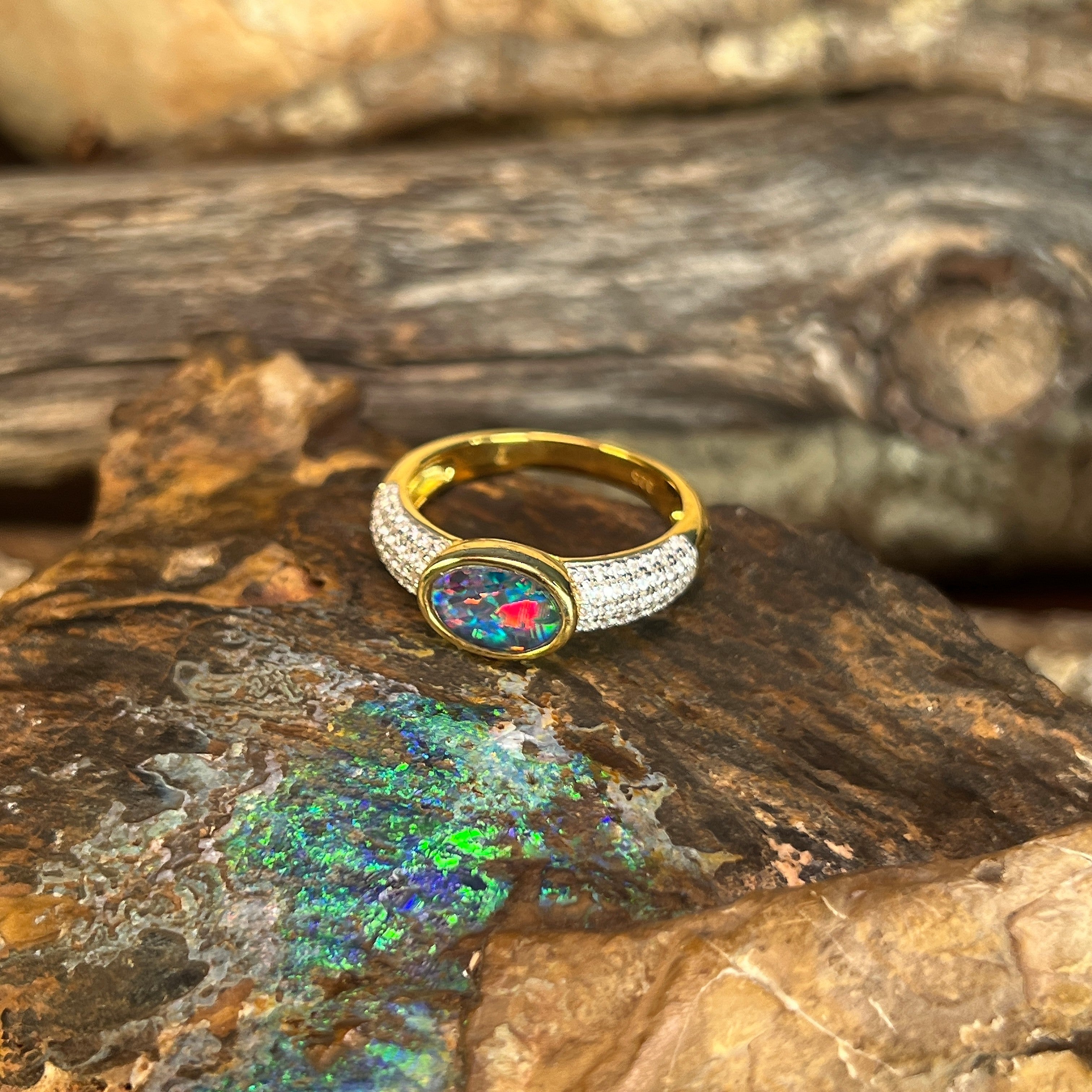 red, blue and green play-of-colour in a 8 x 6mm oval Australian opal triplet ring
