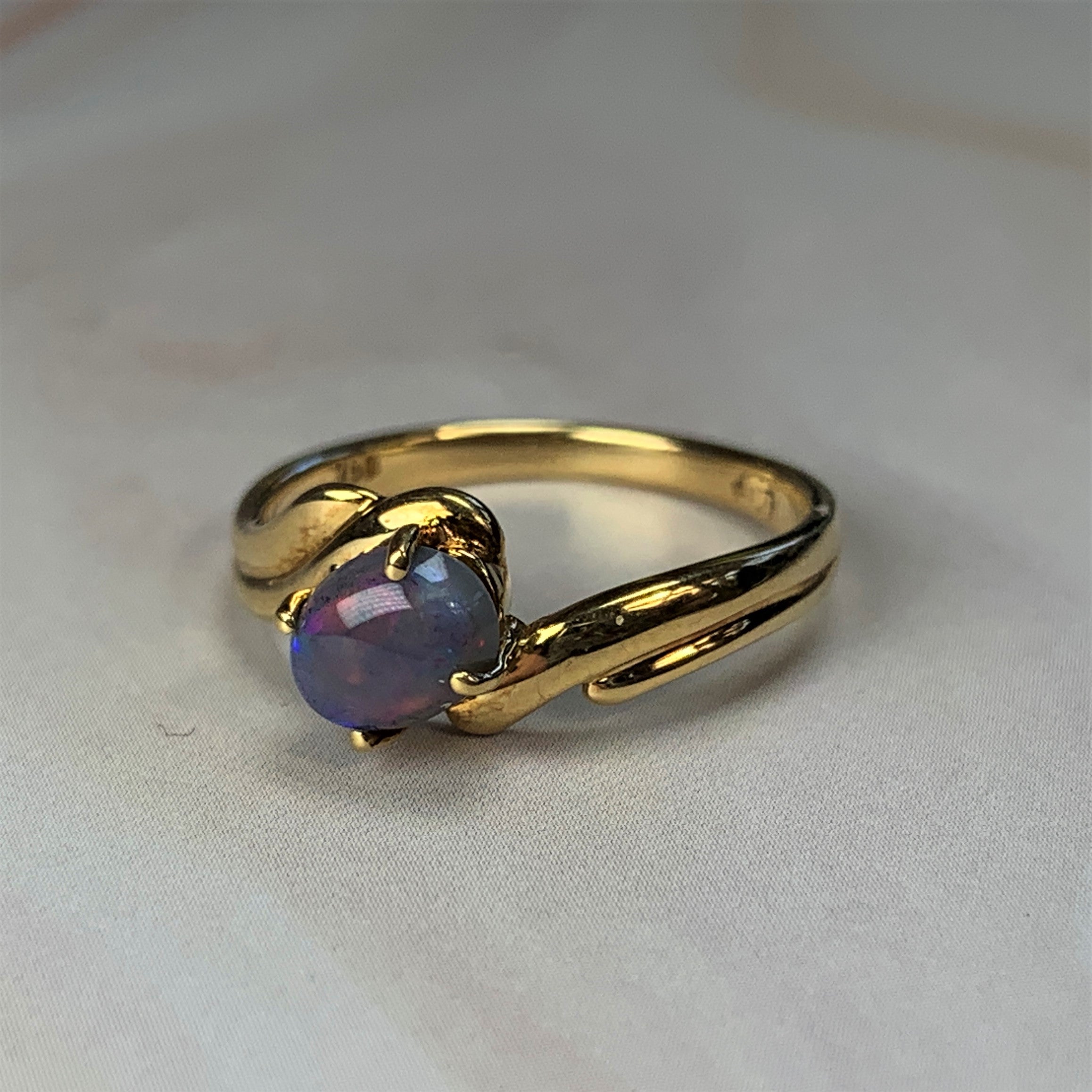 18kt Yellow Gold Black Opal 0.63ct cross over split shank ring - Masterpiece Jewellery Opal & Gems Sydney Australia | Online Shop