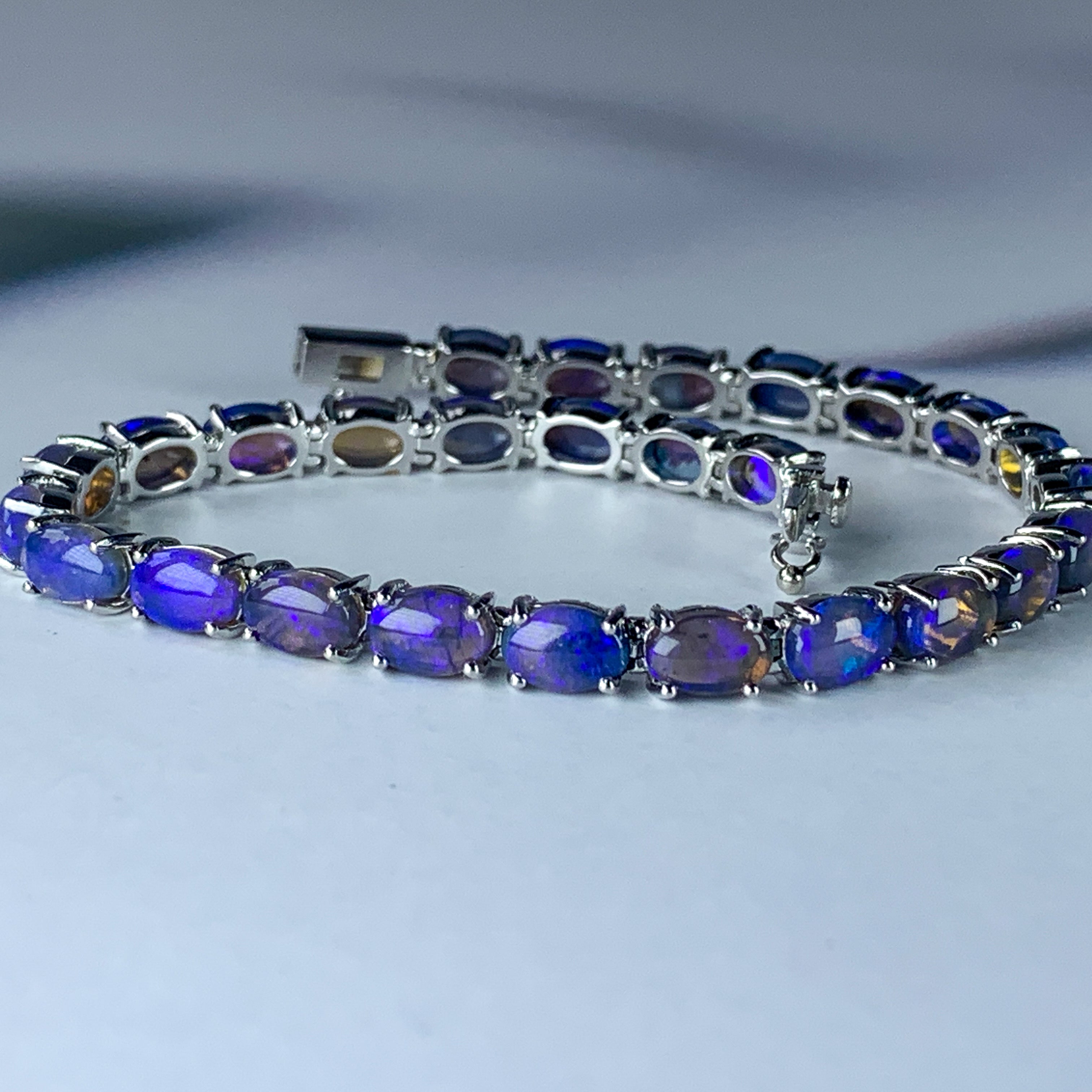 Sterling Silver Black Opal 7x5mm tennis bracelet - Masterpiece Jewellery Opal & Gems Sydney Australia | Online Shop